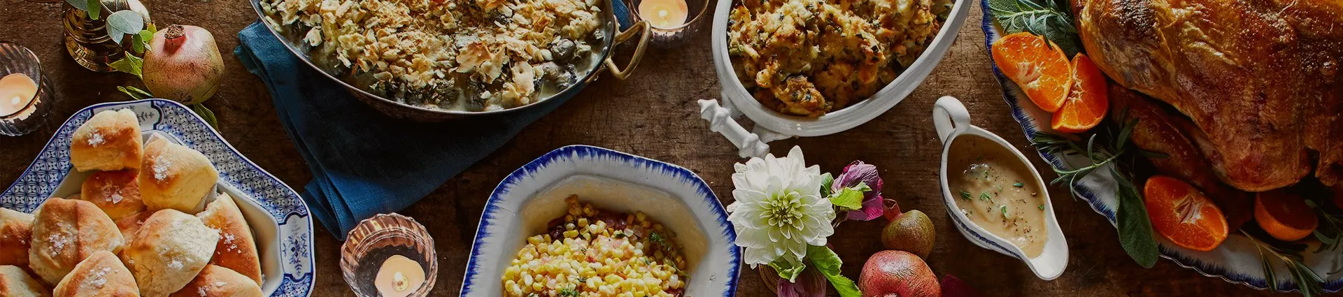 Thanksgiving meal with pumpkins, autumn tones and cooked stuffed turkey
