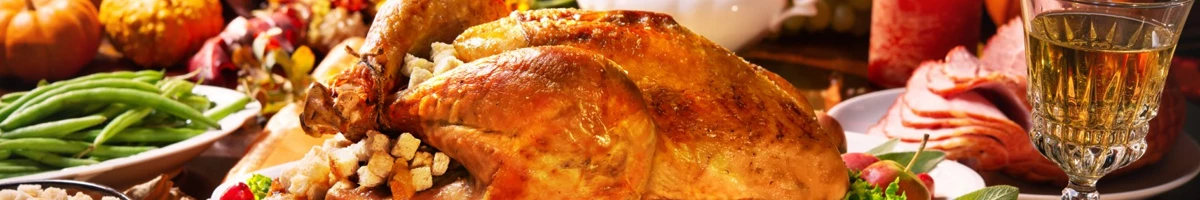 Thanksgiving meal with mashed potatoes, salt pieces of bread, salad with corn and gravy sauce for the turkey